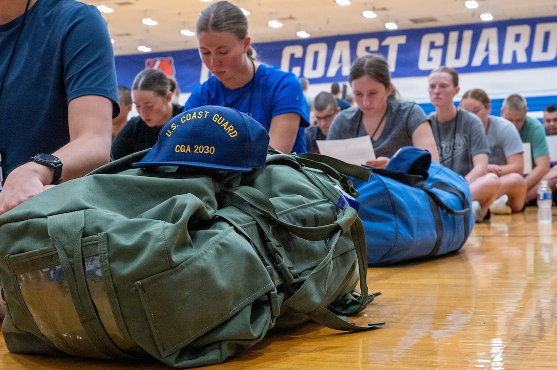 U.S. Coast Guard Academy (USCGA) Class of 2030 swabs wait for their Cadet Cadre to pick them up at USCGA, New London, Connecticut, June 29, 2026. Day One marks the start of Swab Summer, an intensive seven-week program that prepares students for military and Academy life. (U.S. Coast Guard photo by Petty Officer Third Class Roxanna Jacobo Cruz)