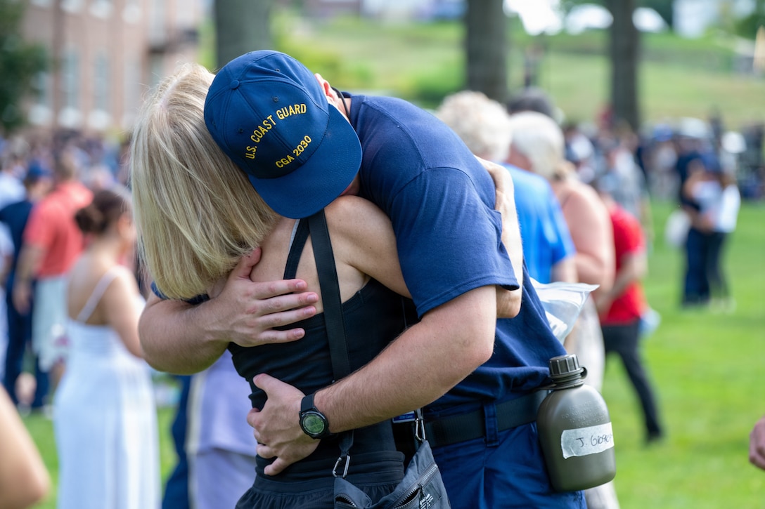 U.S. Coast Guard Academy (USCGA) swab from the Class of 2030 hug a loved one during Day One at USCGA, New London, Connecticut, June 29, 2026. The new Class of 2030 are given 15 minutes to say goodbye to their families before they enter the seven-week training environment. (U.S. Coast Guard photo by Petty Officer 2nd Class Janessa-Reyanna Warschkow)