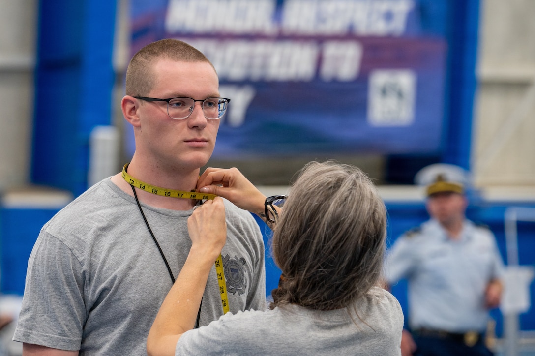 U.S. Coast Guard Academy (USCGA) Class of 2030 swabs get measured for their uniforms during check in at USCGA, New London, Connecticut, June 29, 2026. Day One marks the start of Swab Summer, an intensive seven-week program that prepares students for military and Academy life.(U.S. Coast Guard photo by Petty Officer Third Class Roxanna Jacobo Cruz)
