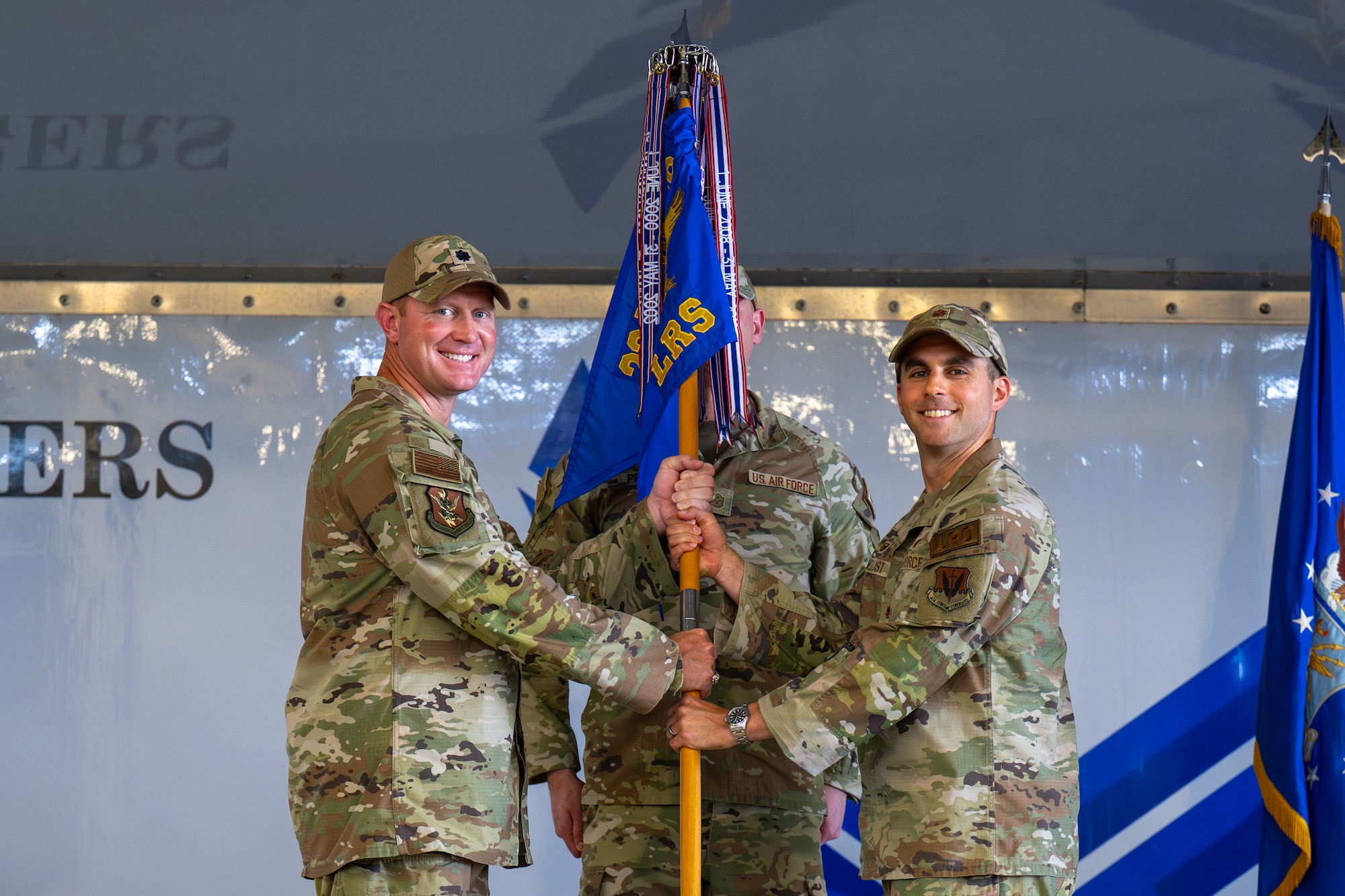 Person passing guidon to another.