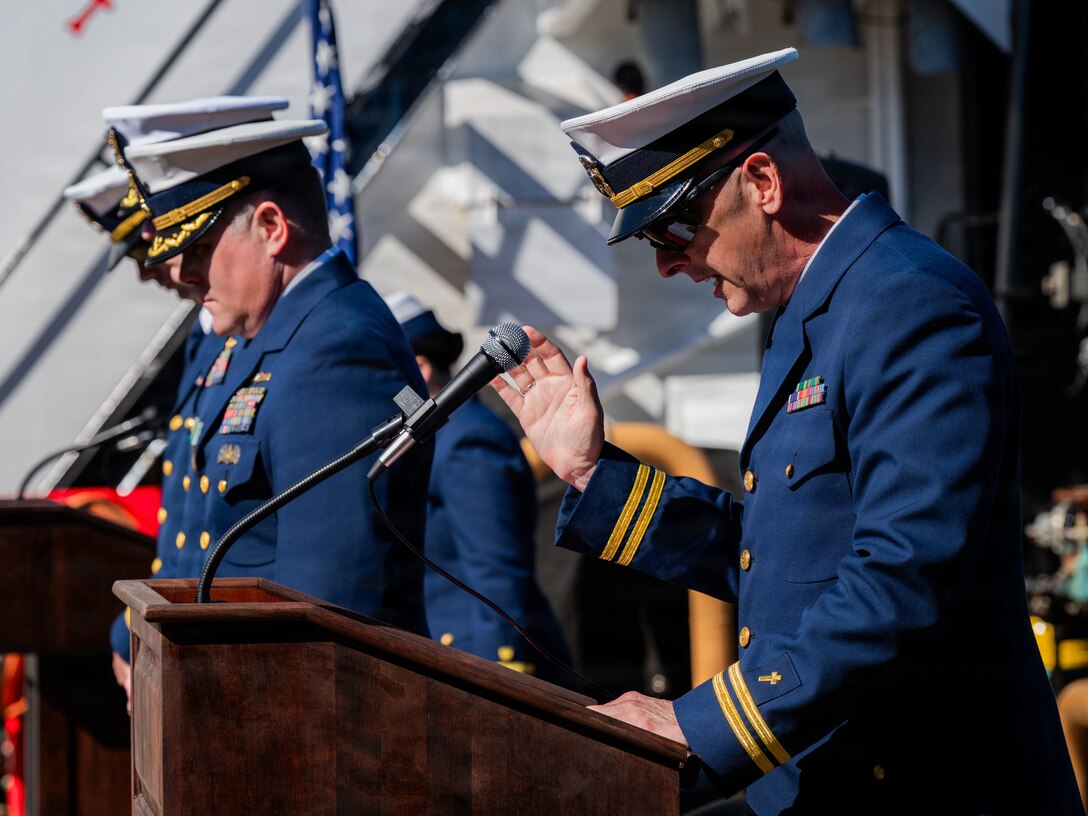 Navy Lt. Clay Hamrick, chaplain for Coast Guard Base Kodiak, delivers a benediction during a change of command ceremony aboard Coast Guard Cutter Cypress (WLB 210) in Kodiak, Alaska, June 25, 2026. Change of command ceremonies are a formal naval tradition that are intended to strengthen respect when the responsibility and authority of a commanding officer is transferred to another. (U.S. Coast Guard photo by Petty Officer 3rd Class Cameron Snell)