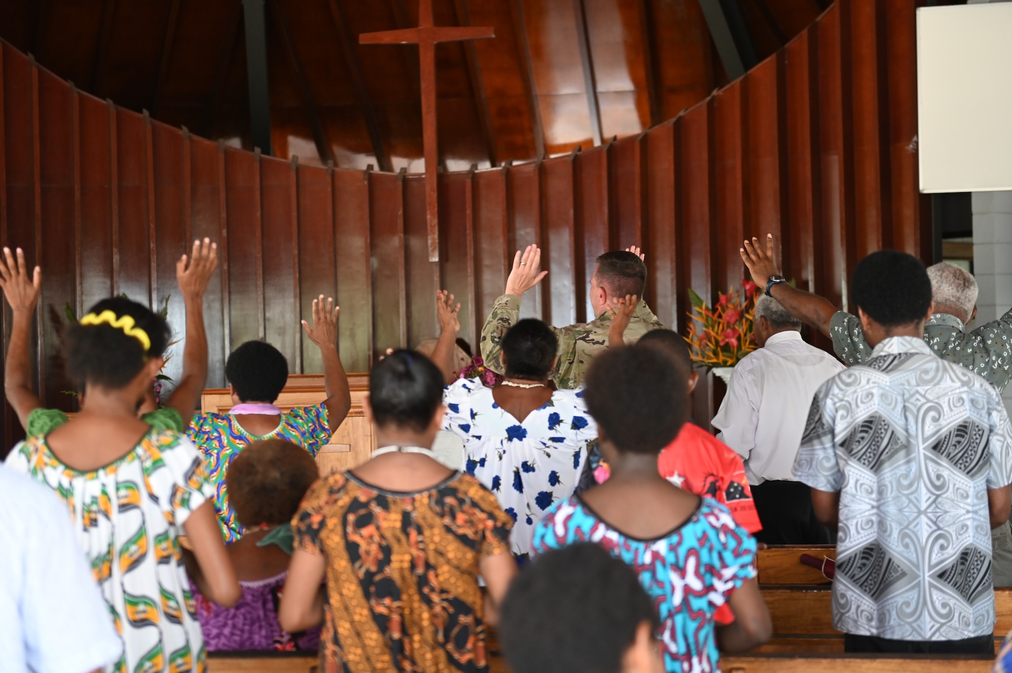U.S. Air Force Lt. Col. James Buckman, assigned to the 115th Fighter Wing, Wisconsin Air National Guard, participates in a hymn during a religious service at St. Paul’s Chapel, Murray Barracks, in the National Capitol District, Port Moresby, Papua New Guinea March 16, 2025. The Wisconsin National Guard State Partnership Program is working with the U.S. Embassy team in PNG and the PNGDF on a consolidated exchange in PNG during fiscal year 2025 that includes four subject matter expert exchanges. (U.S. Air National Guard photo by Master Sgt. Mary Greenwood)