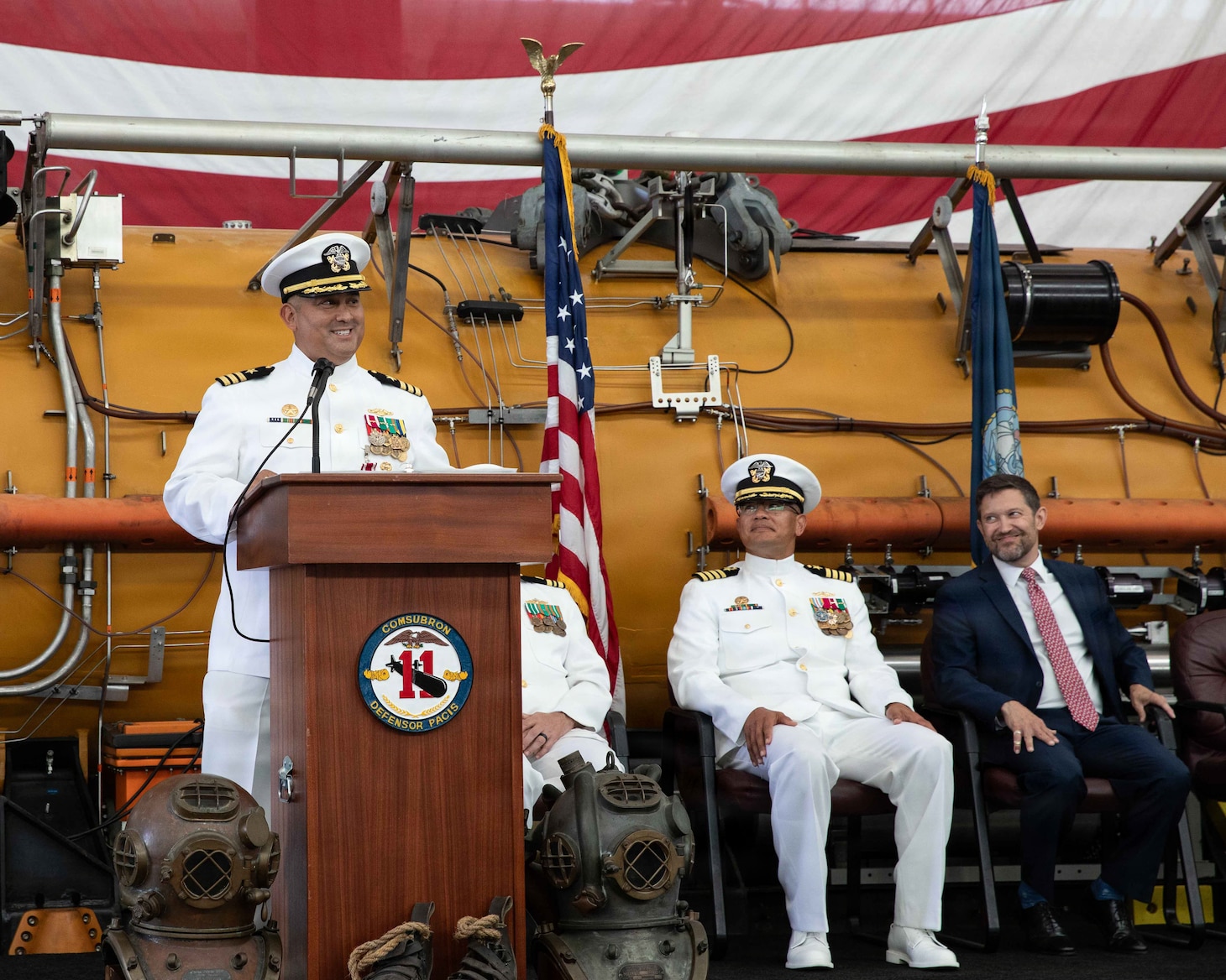 NAVAL AIR STATION NORTH ISLAND, Calif. (June 26, 2026) Cmdr. Christian Rivera, off-going commanding officer, Undersea Rescue Command (URC), speaks during the change of command ceremony for URC onboard Naval Air Station North Island, June 26, 2026. During the ceremony, Rivera was relieved by Cmdr. Michael Mowry as commanding officer of URC.  URC, comprised of active and Reserve component Sailors, and civilian contractors, is the Navy’s only submarine rescue-capable command ready to deploy around the world in the event of a submarine emergency. (U.S. Navy photo by Mass Communication Specialist 2nd Class Rashan Jefferson)
