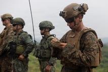 U.S. Marine Corps Lance Cpl. Nathaniel T. Gutierrez, a radio operator with 3rd Littoral Combat Team, 3rd Marine Littoral Regiment, 3rd Marine Division, takes notes while observing a Neros Archer live-fire range as part of KAMANDAG 10 at Fort Magsaysay, Nueva Ecija, Philippines, June 15, 2026.