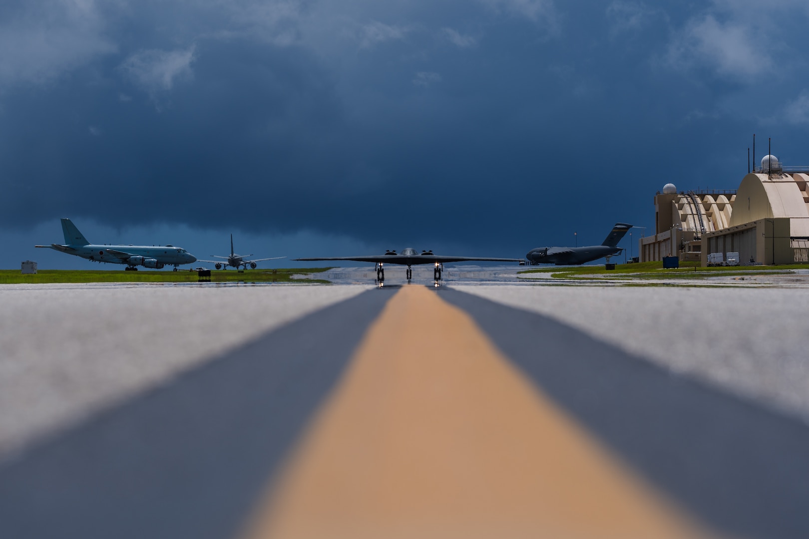 A stealth bomber taxis on an airfield