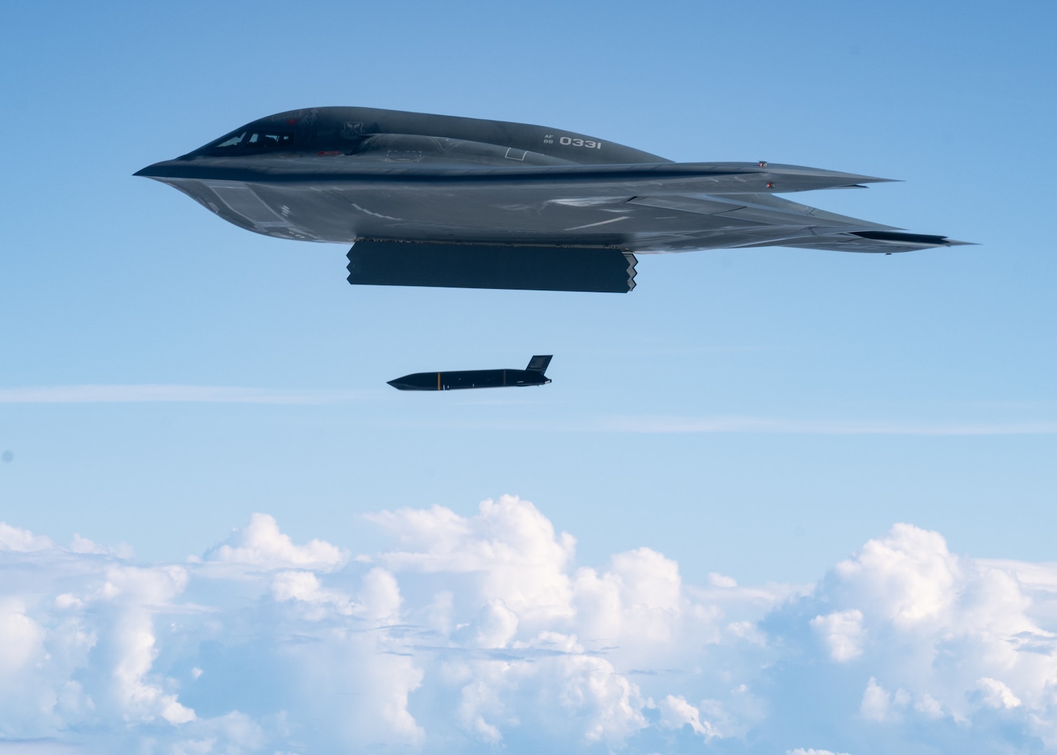 A stealth bomber fires a cruise missile
