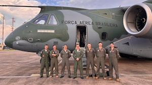 Students from U.S. Air Force Test Pilot School Class 25-B and their instructors pose with members of the Brazilian Air Force during their international capstone project. (Courtesy photo)