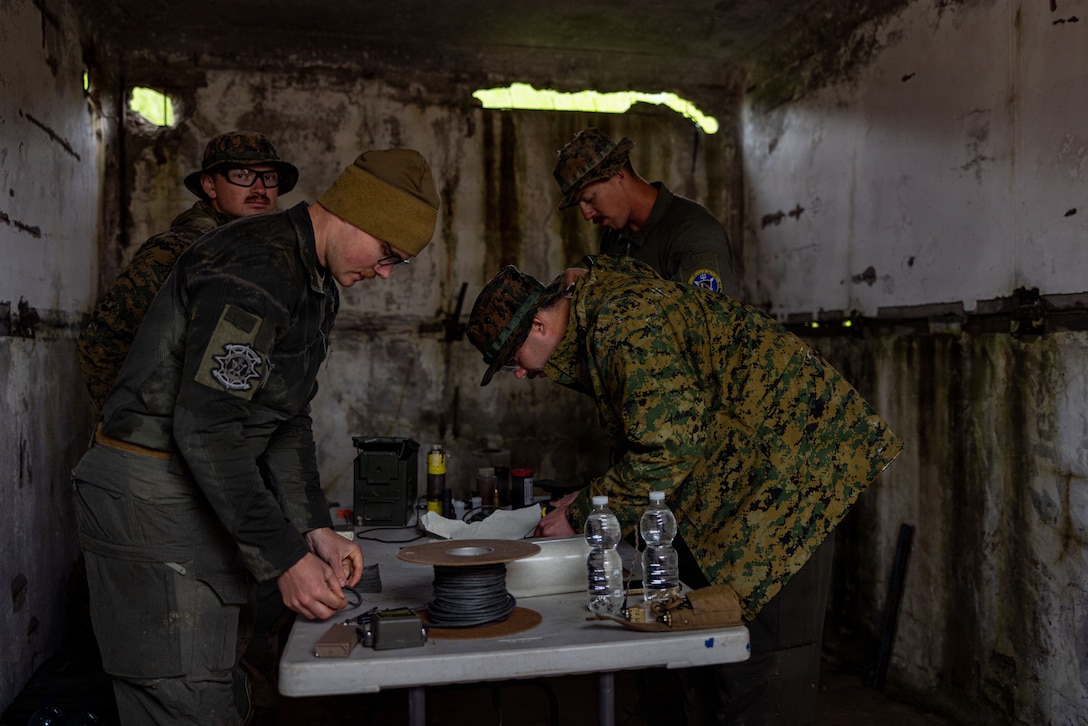 U.S. Marines with Combat Logistics Battalion 24, Combat Logistics Regiment 27, 2nd Marine Logistics Group, prepare for a demolition range demonstration during exercise Baltic Operations 26 in Skrunda, Latvia, June 16, 2026. BALTOPS 2026, the premier maritime-focused exercise in the Baltic Region, provides a unique training opportunity to strengthen combined response capabilities critical to preserving freedom of navigation and security in the Baltic Sea. (U.S. Marine Corps photo by Lance Cpl. Brady V. Hathaway)