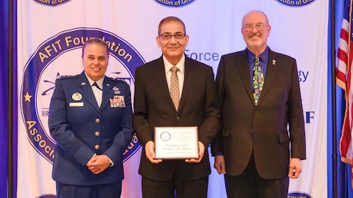 The Air Force Institute of Technology and the AFIT Foundation and Association of Graduates recognized five alumni for their outstanding career achievements in a ceremony on June 19. Lt. Gen. Linda S. Hurry, commander, Air Force Materiel Command, and AFIT alumnus, was the featured speaker.  The International Alumni Award was presented to (Ret.) Maj. Gen. Moataz M. Salah, Ph.D. (center), by Lt. Gen. Linda S. Hurry, commander, Air Force Materiel Command (left) and Dr. Lance Chenault, AFIT Foundation and Association of Graduates president (right).