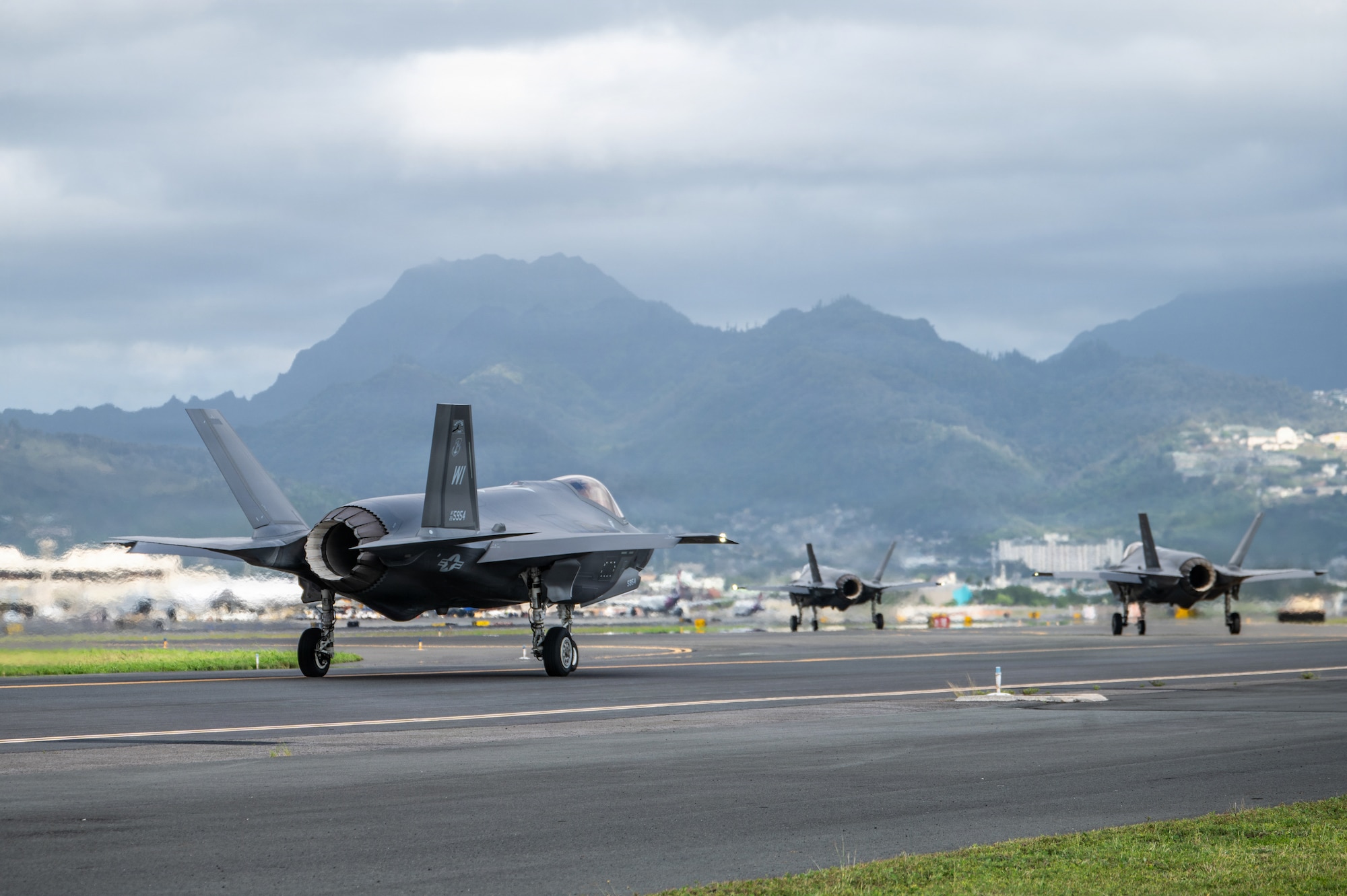 U.S. Air Force F-35A Lightning II aircraft assigned to the 115th Fighter Wing, Wisconsin Air National Guard, taxi for launch during exercise Sentry Aloha 26-1 at Joint Base Pearl Harbor-Hickam, Hawaii, Jan. 14, 2026. Sentry Aloha is built around Dissimilar Air Combat Training, which challenges pilots to engage in combat scenarios against aircraft with different performance capabilities. (U.S. Air National Guard photo by Master Sgt. Mary Greenwood)