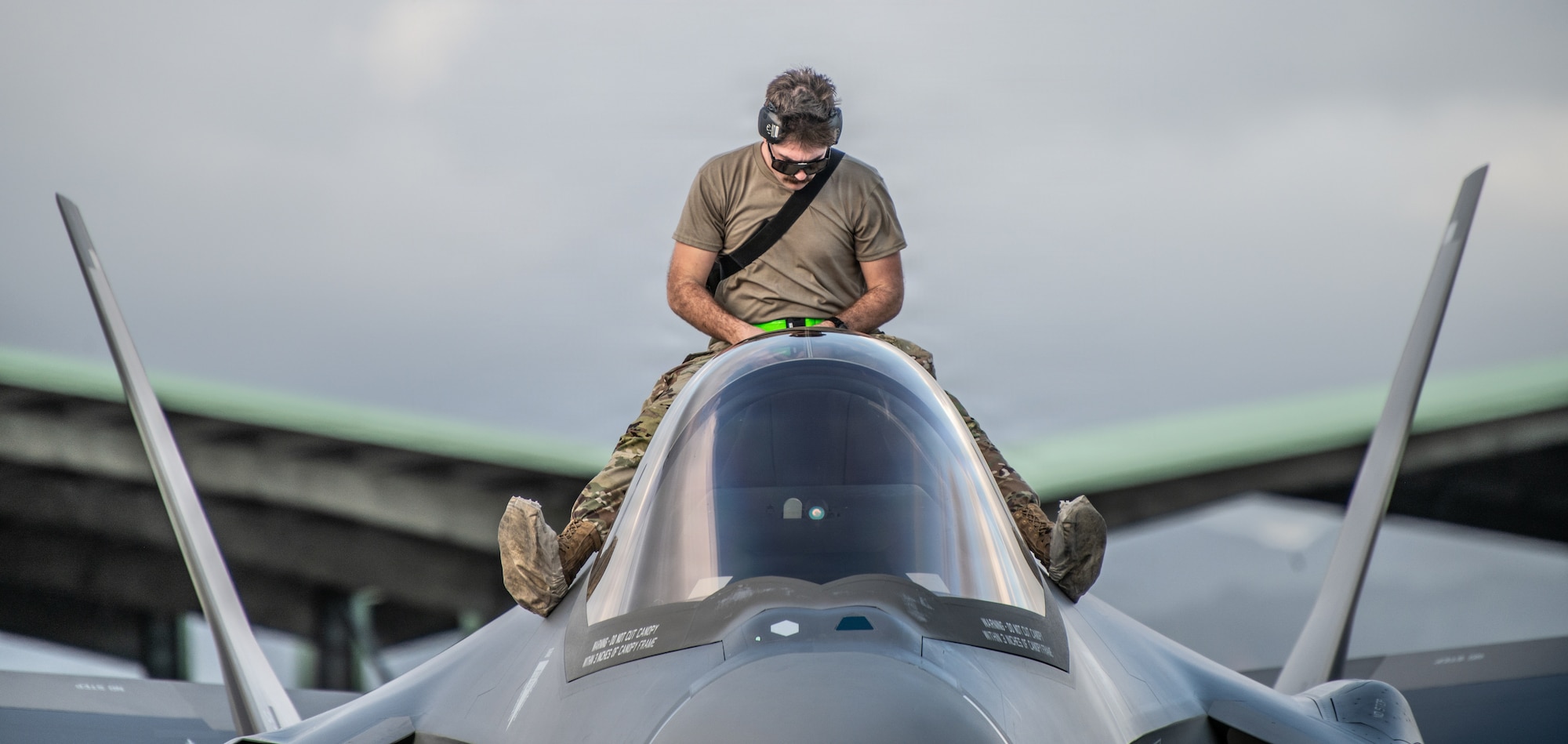 U.S. Air Force Staff Sgt. Kade Parsons, a low observable aircraft structural maintenance specialist assigned to the 115th Fighter Wing, Wisconsin Air National Guard, performs post-flight maintenance on aN F-35A Lightning II aircraft during exercise Sentry Aloha 26-1 at Joint Base Pearl Harbor-Hickam, Hawaii, Jan. 14, 2026. Sentry Aloha is built around Dissimilar Air Combat Training, which challenges pilots to engage in combat scenarios against aircraft with different performance capabilities. (U.S. Air National Guard photo by Master Sgt. Mary Greenwood)