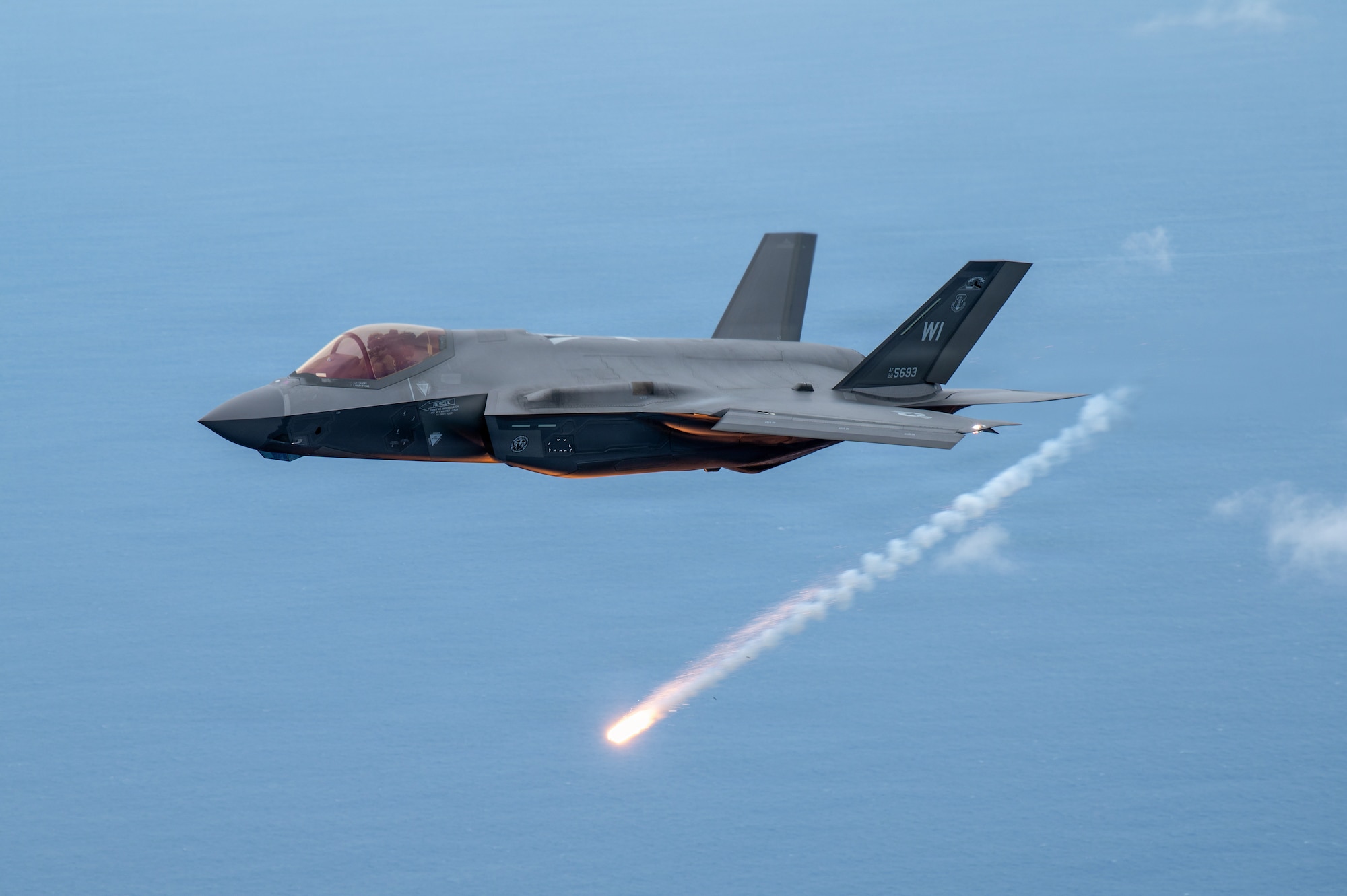 A U.S. Air Force F-35A Lightning II aircraft assigned to the 115th Fighter Wing, Wisconsin Air National Guard, lets off flares during exercise Sentry Aloha 26-1, over the Pacific Ocean, Jan. 20, 2026. Sentry Aloha is built around Dissimilar Air Combat Training, which challenges pilots to engage in combat scenarios against aircraft with different performance capabilities. (U.S. Air National Guard photo by Master Sgt. Mary Greenwood)