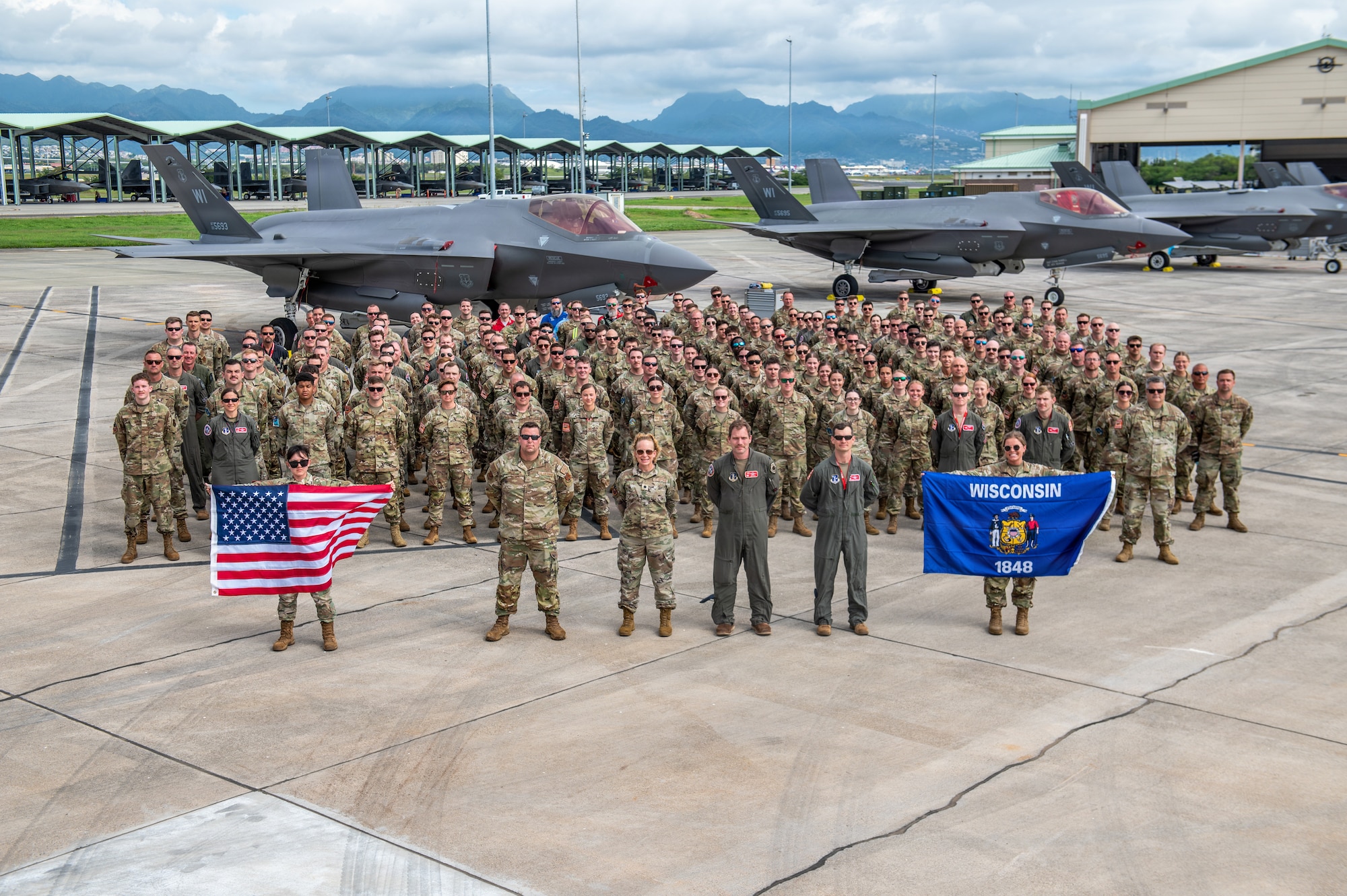 U.S. Airmen assigned to the 115th Fighter Wing, Wisconsin Air National Guard, pose for a group photo during exercise Sentry Aloha 26-1 at Joint Base Pearl Harbor-Hickam, Hawaii, Jan. 27, 2026. Sentry Aloha is built around Dissimilar Air Combat Training, which challenges pilots to engage in combat scenarios against aircraft with different performance capabilities. (U.S. Air National Guard photo by Master Sgt. Mary Greenwood)
