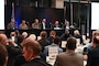 U.S. Air Force Maj. Gen. Ty Neuman, center front of room, commander of Eighth Air Force and Joint-Global Strike Operations Center, participates in a discussion panel during the 27th annual Nuclear Triad Symposium