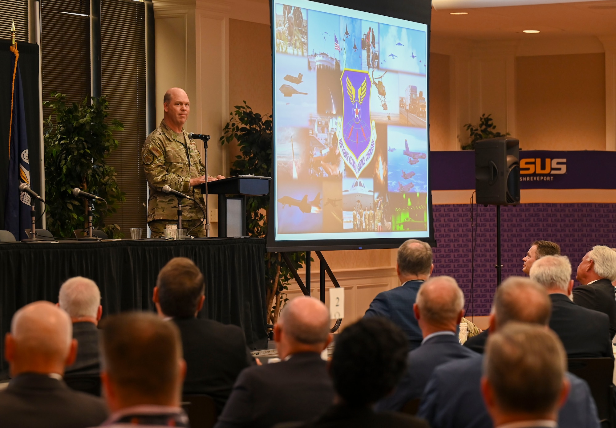U.S. Air Force Gen. S.L. Davis, front of room, commander of Air Force Global Strike Command, delivers a keynote speech during the 27th annual Nuclear Triad Symposium