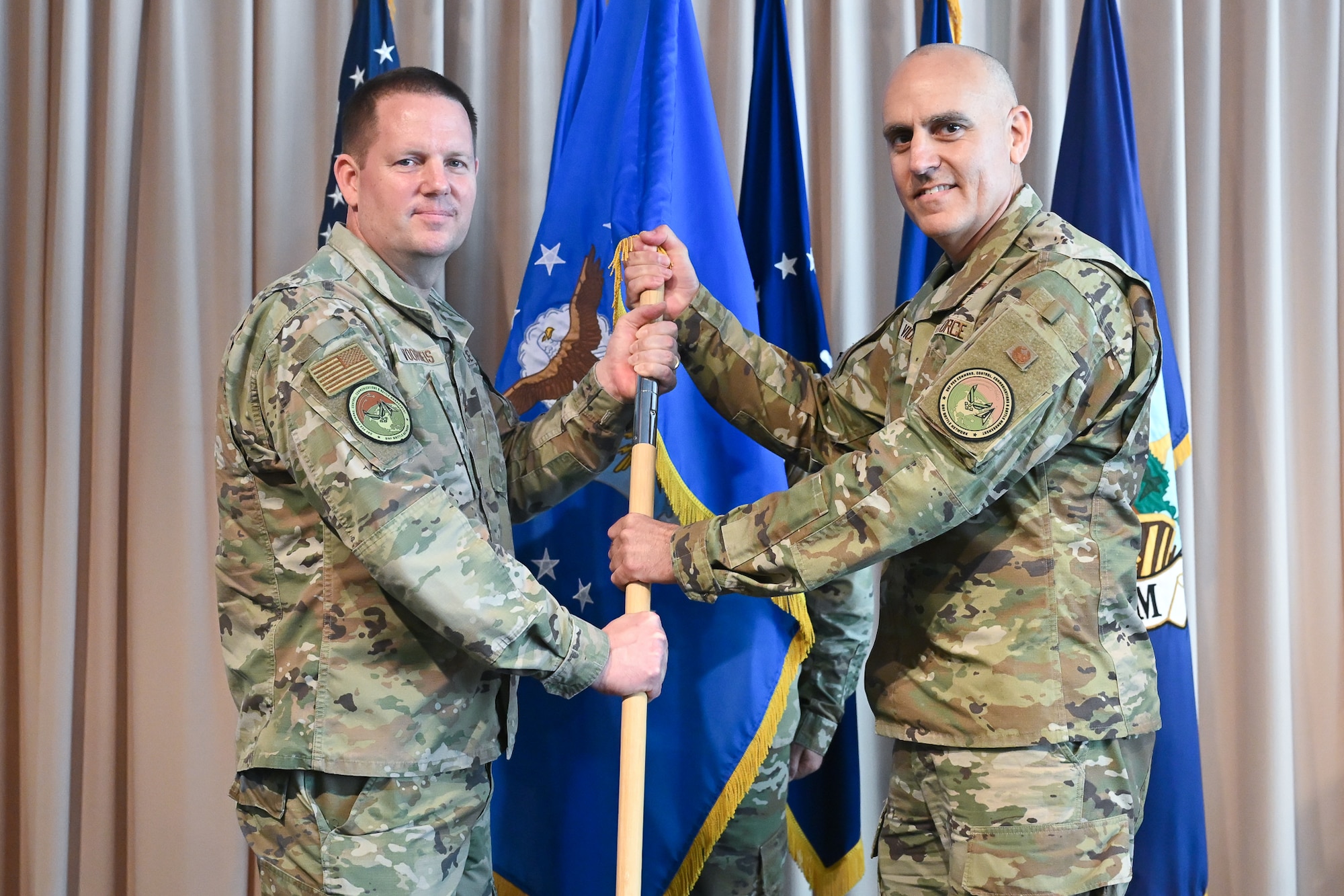 Brig. Gen. Jason Voorheis, left, appoints Col. Brian Viola as Kessel Run’s senior materiel leader during a ceremony at the Minuteman Commons, here, June 25. Voorheis is the Department of the Air Force Portfolio Acquisition Executive for Command, Control, Communications and Battle Management. Kessel Run is a division within C3BM focused on delivering resilient command and control and targeting software capabilities that provide operators with decision advantage. (Official Air Force photo by Richard Blumenstein).