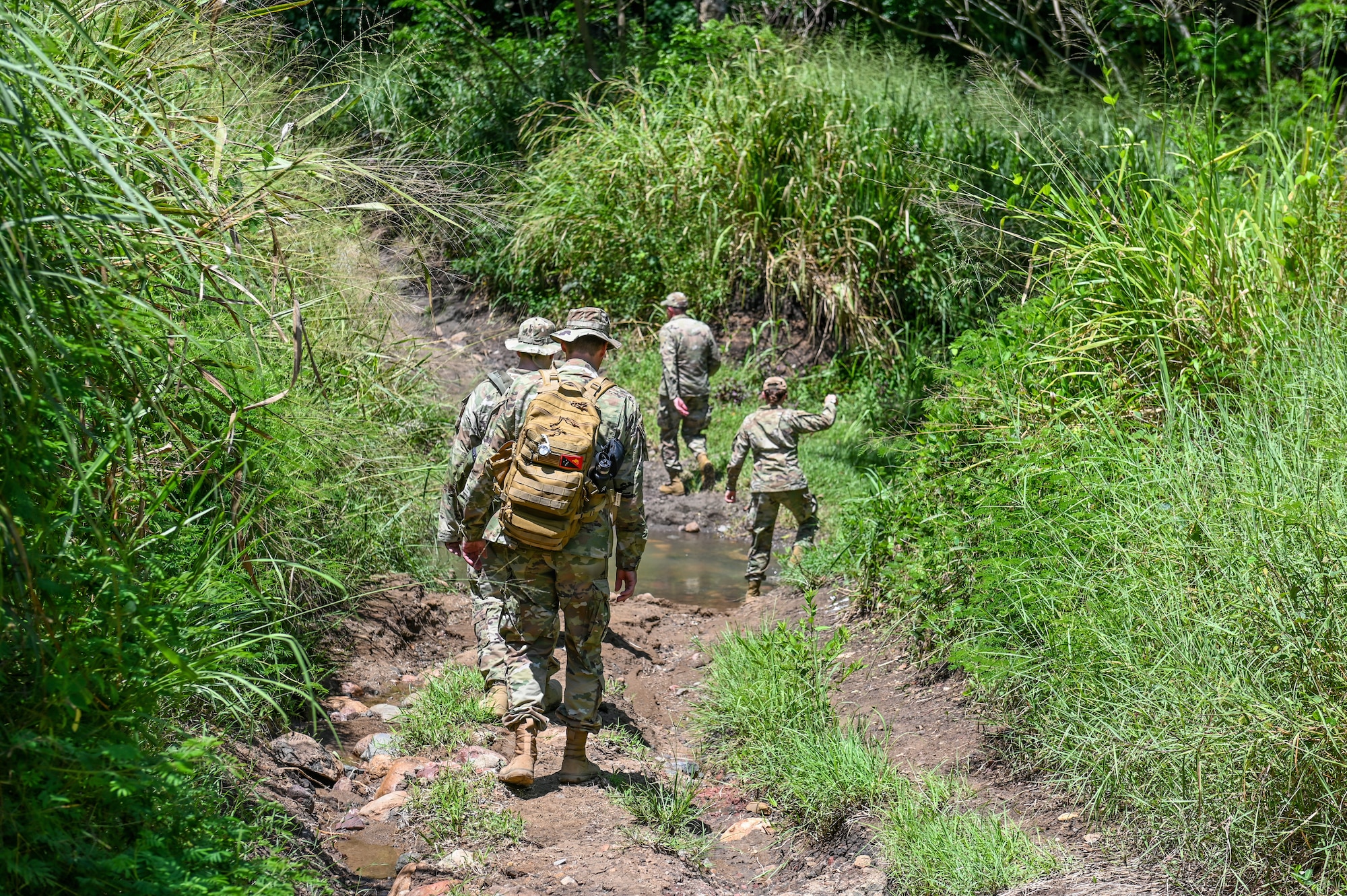 U.S. Airmen assigned to the Wisconsin Air National Guard, retrace the steps the 32nd Division took during their march across New Guinea on the Gaba Gaba trail, National Capital District, Papua New Guinea, March 17, 2025. The Wisconsin National Guard traveled to PNG as part of the State Partnership Program subject matter expert exchange. (U.S. Air National Guard photo by Master Sgt. Mary Greenwood)