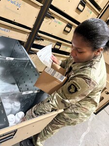 A Soldier prepares medical supplies for shipping and delivery to customer.