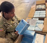 A Soldier prepares medical supplies for shipping and delivery to customer.
