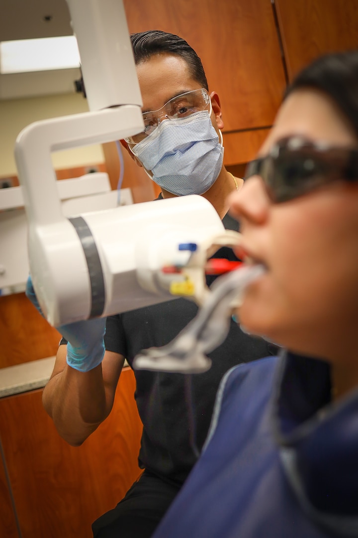 For decades, dental teams relied on heavy lead aprons like the one pictured here to shield patients from old-school film X-rays. Today, Fort Riley’s modern digital radiography has reduced radiation to such negligible levels that the heavy apron is no longer clinically necessary. With modern digital radiography, a routine X-ray emits less radiation exposure than a standard cross-country commercial flight.