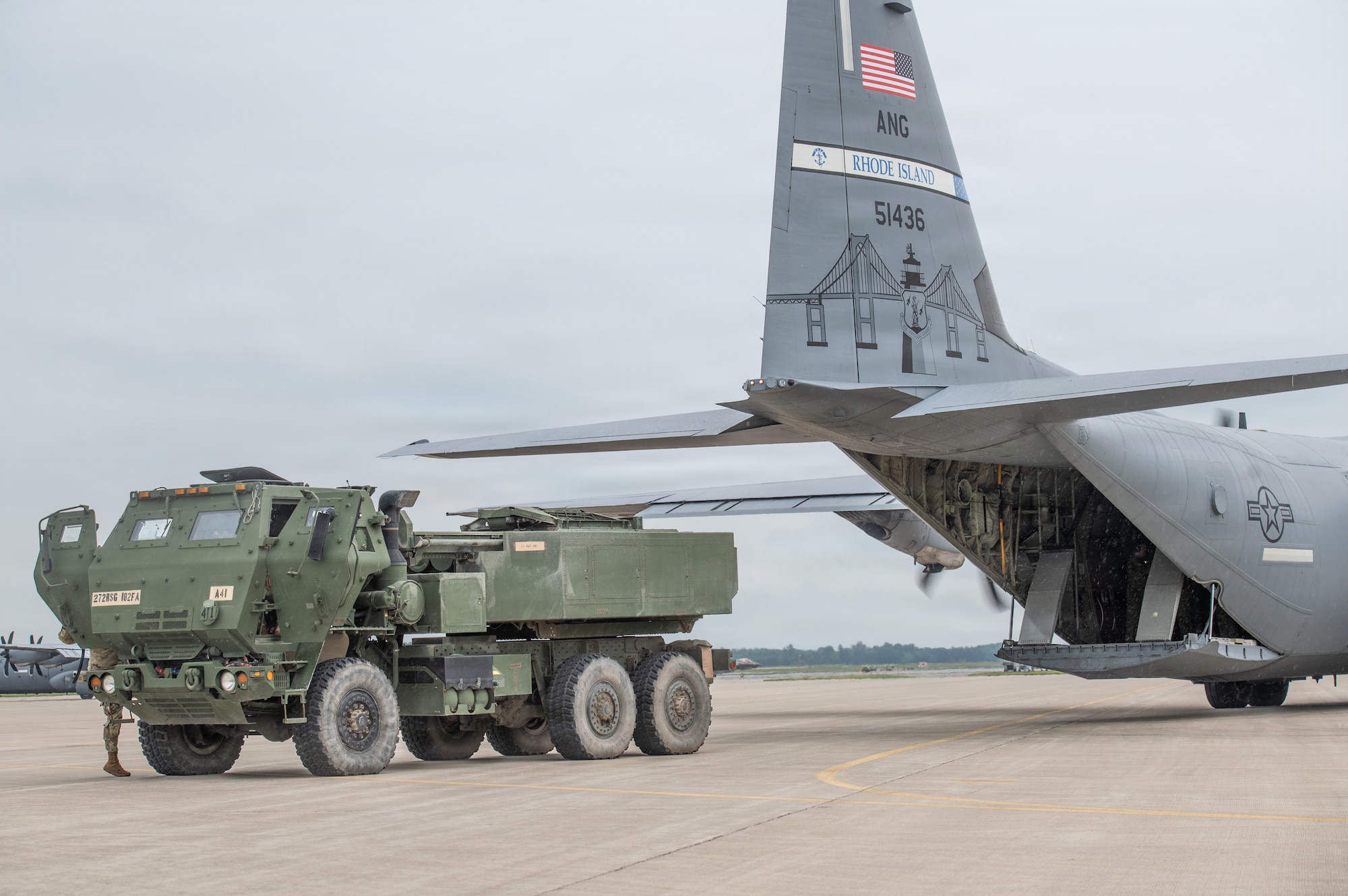 A U.S. Army high mobility artillery rocket system (HIMARS) assigned to the 1st Battalion, 182nd Field Artillery Regiment, Michigan Army National Guard, unloads from the cargo compartment of a U.S. Air Force C-130J Hercules assigned to the 143rd Airlift Wing, Rhode Island Air National Guard during Sentry North 2026 at Volk Field Combat Readiness Training Center, Camp Douglas, Wisconsin, June 8, 2026. Sentry North 2026 is a joint total force exercise led by the National Guard Bureau Readiness Training Program and hosted by Volk Field Combat Readiness Training Center and Alpena Combat Readiness Training Center. (U.S. Air National Guard photo by Master Sgt. Mary Greenwood)
