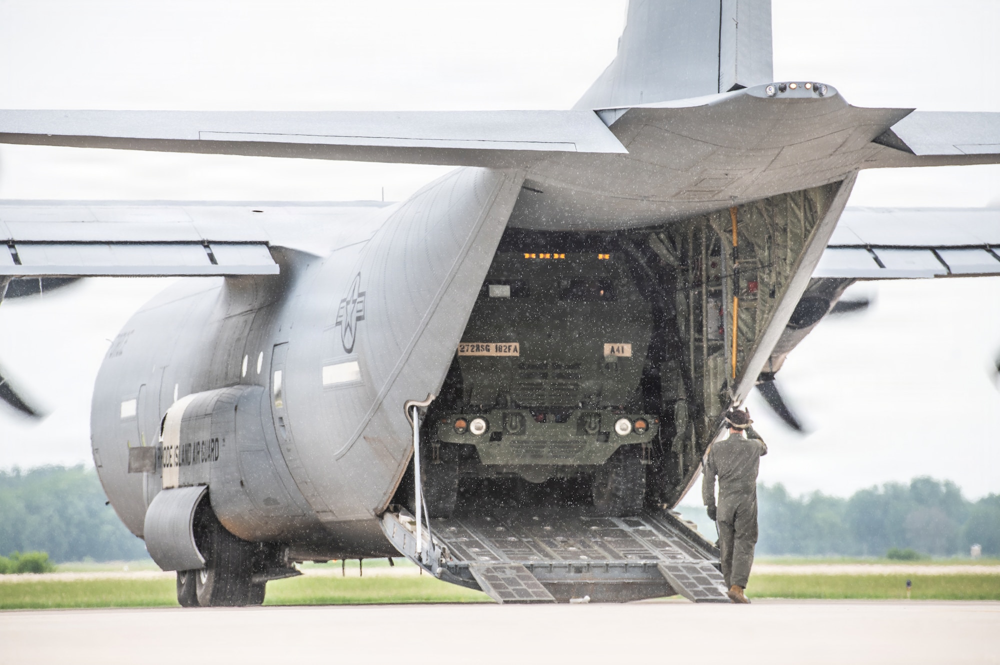 A U.S. Army high mobility artillery rocket system (HIMARS) assigned to the 1st Battalion, 182nd Field Artillery Regiment, Michigan Army National Guard, loads into the cargo compartment of a U.S. Air Force C-130J Hercules assigned to the 143rd Airlift Wing, Rhode Island Air National Guard during Sentry North 2026 at Volk Field Combat Readiness Training Center, Camp Douglas, Wisconsin, June 8, 2026. Sentry North 2026 is a joint total force exercise led by the National Guard Bureau Readiness Training Program and hosted by Volk Field Combat Readiness Training Center and Alpena Combat Readiness Training Center. (U.S. Air National Guard photo by Master Sgt. Mary Greenwood)