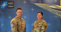U.S. Air Force Tech. Sgt. Michael Cazares Montano, noncommissioned officer in charge of the Air National Guard and U.S. Air Force Capt. Savanna Cuestes, Intelligence, Surveillance, and Reconnaissance deputy lead, pose for a photo June 16, 2026, in Bodø, Norway, during exercise Ramstein Flag 2026.