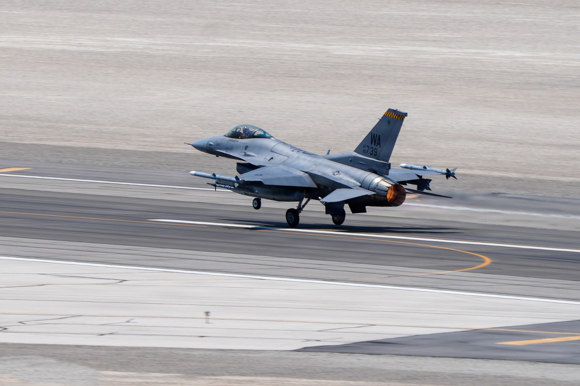 A U.S. Air Force F-16C Fighting Falcon aircraft assigned to the 64th Aggressor Squadron takes off from the runway during exercise VENOM FORGE at Creech Air Force Base June 17, 2026. These exercises help maintain the skills required to maintain advanced airpower in operations worldwide. (U.S. Air Force photo by Airman Vinh Phan)