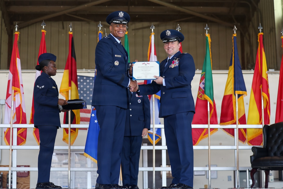 U.S. Air Force Maj. Gen. Roy W. Collins, Air Education and Training Command deputy commander, presents the Legion of Merit to U.S. Air Force Col. Jeffrey D. Shulman, 80th Flying Training Wing outgoing commander, during the 80th FTW change of command ceremony at Sheppard Air Force Base, Texas, June 29, 2026.