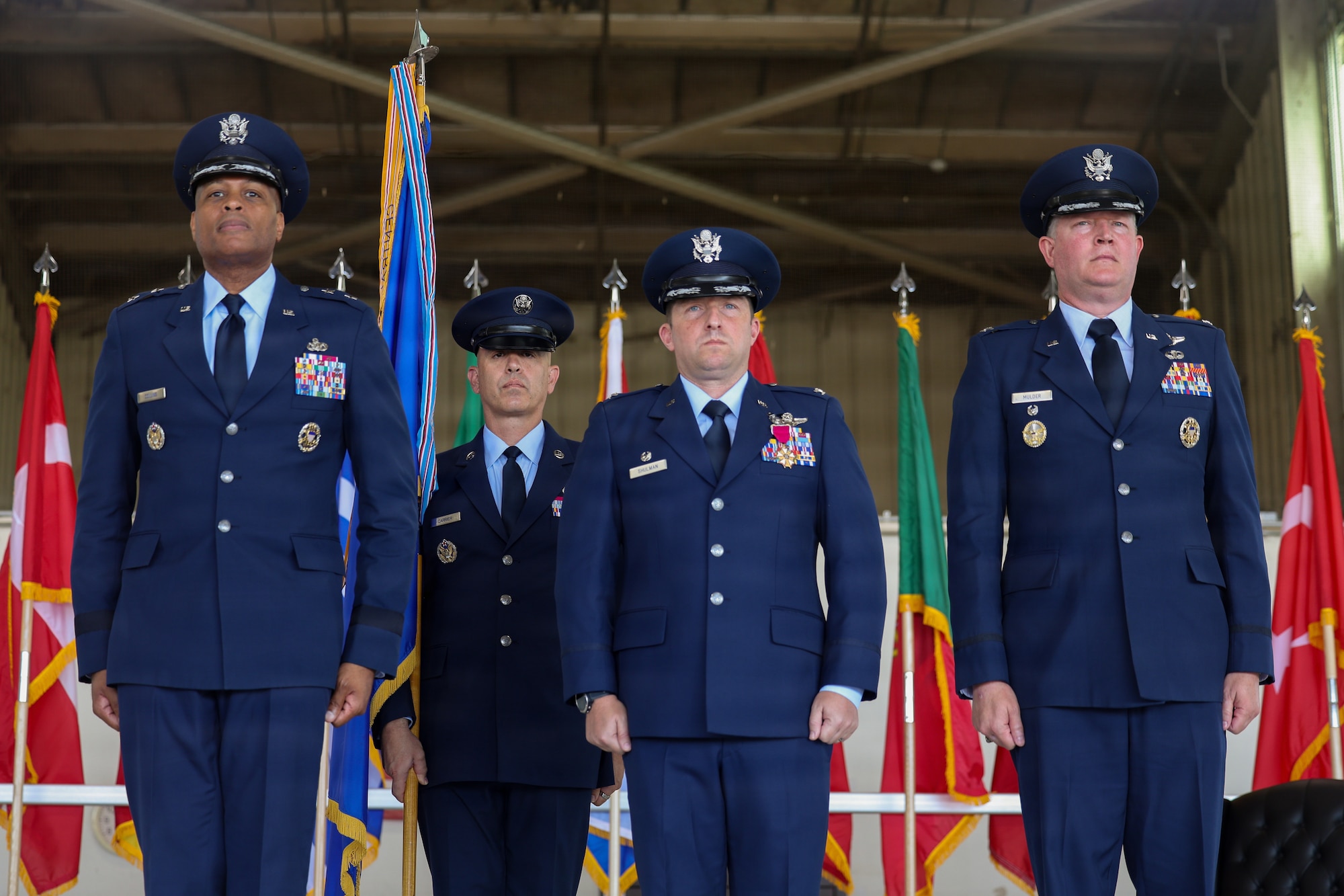 From left, U.S. Air Force Maj. Gen. Roy W. Collins, Air Education and Training Command deputy commander; U.S. Air Force Col. Jeffrey D. Shulman, 80th Flying Training Wing outgoing commander; and U.S. Air Force Col. Christopher P. Mulder, 80th FTW incoming commander, stand at attention during the 80th FTW change of command ceremony at Sheppard Air Force Base, Texas, June 29, 2026.