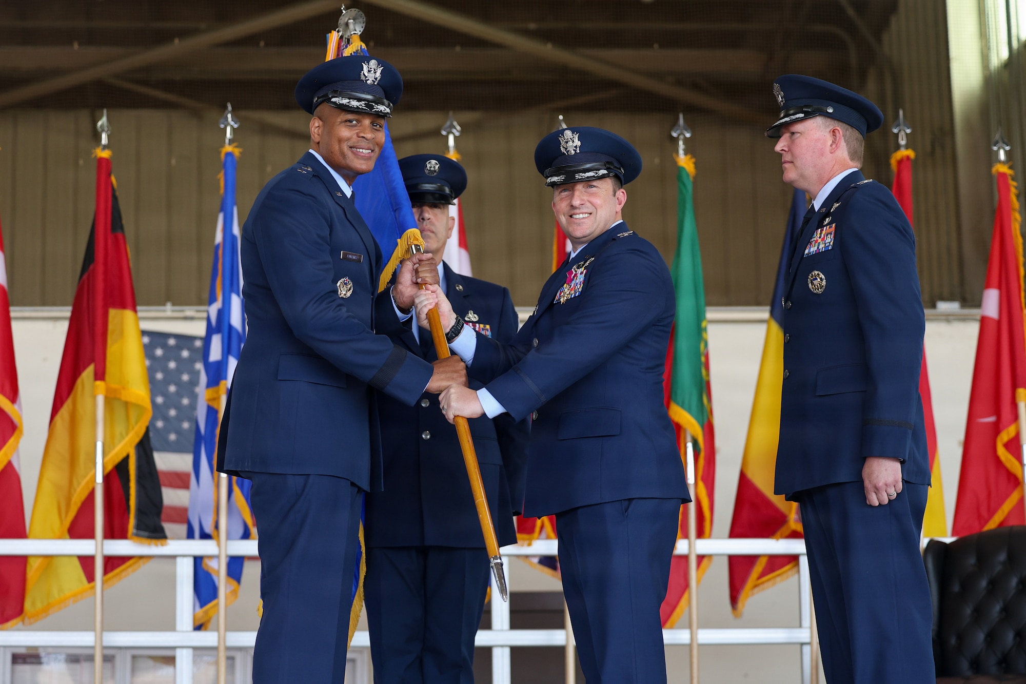 From left, U.S. Air Force Maj. Gen. Roy W. Collins, Air Education and Training Command deputy commander, receives the guidon from U.S. Air Force Col. Jeffrey D. Shulman, 80th Flying Training Wing outgoing commander, during the 80th FTW change of command ceremony at Sheppard Air Force Base, Texas, June 29, 2026.