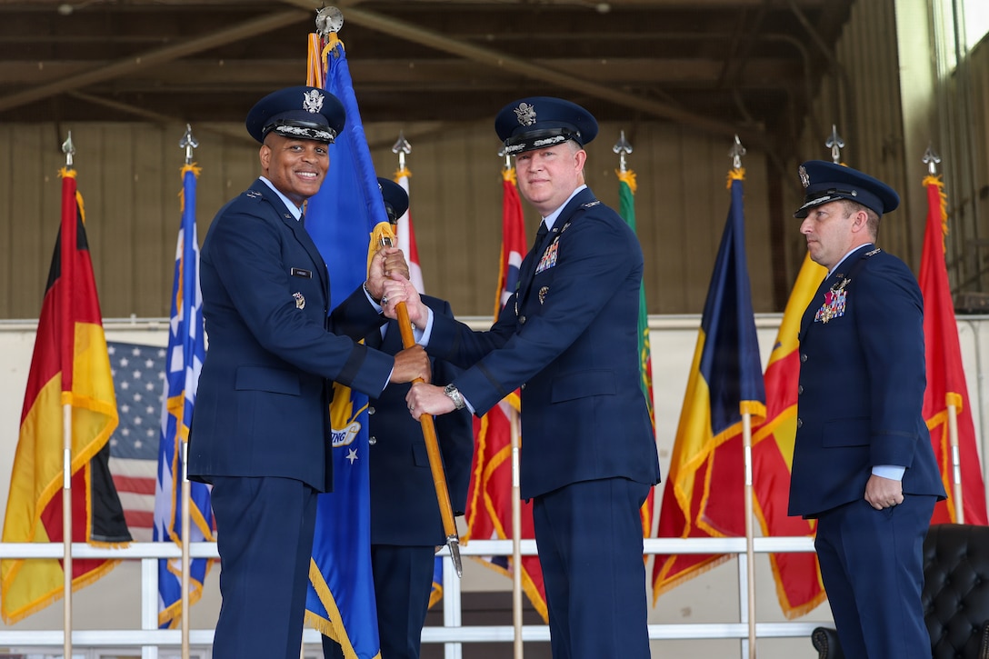 From left, U.S. Air Force Maj. Gen. Roy W. Collins, Air Education and Training Command deputy commander, presents the guidon to U.S. Air Force Col. Christopher P. Mulder, 80th Flying Training Wing incoming commander, during the 80th FTW change of command ceremony at Sheppard Air Force Base, Texas, June 29, 2026.