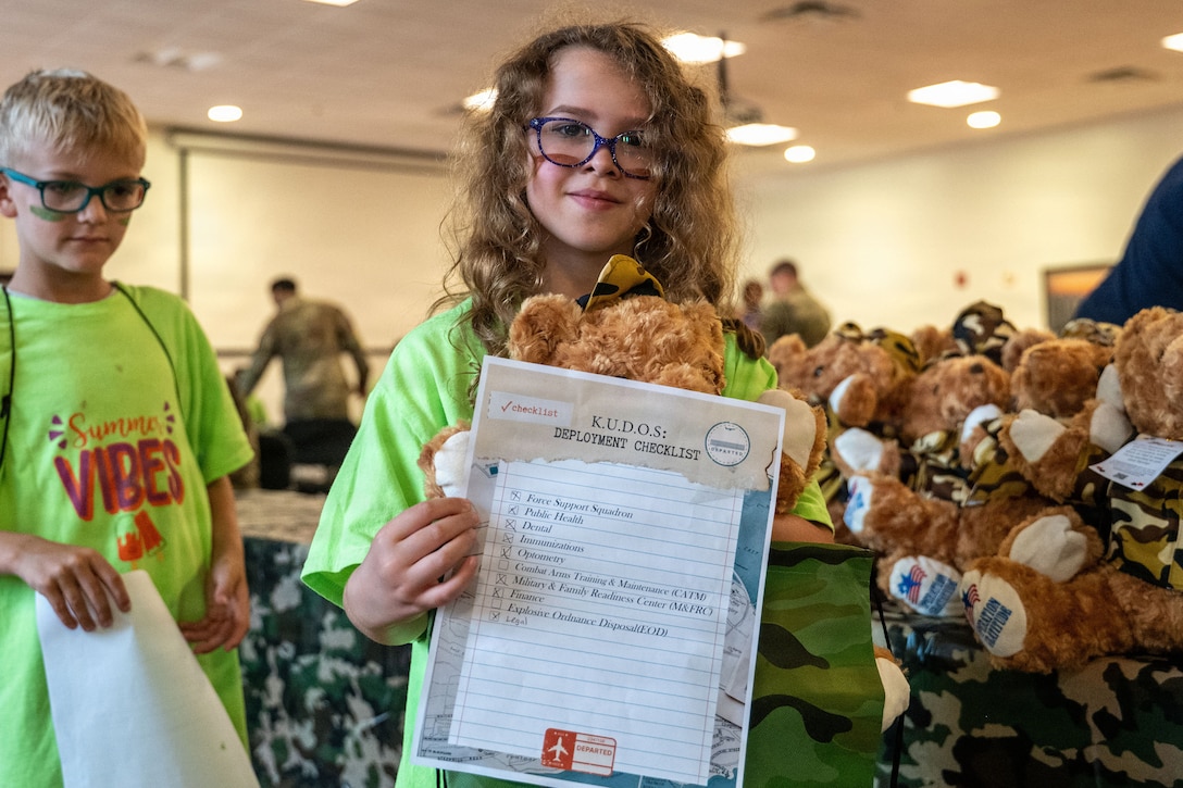 A girl presents her deployment checklist