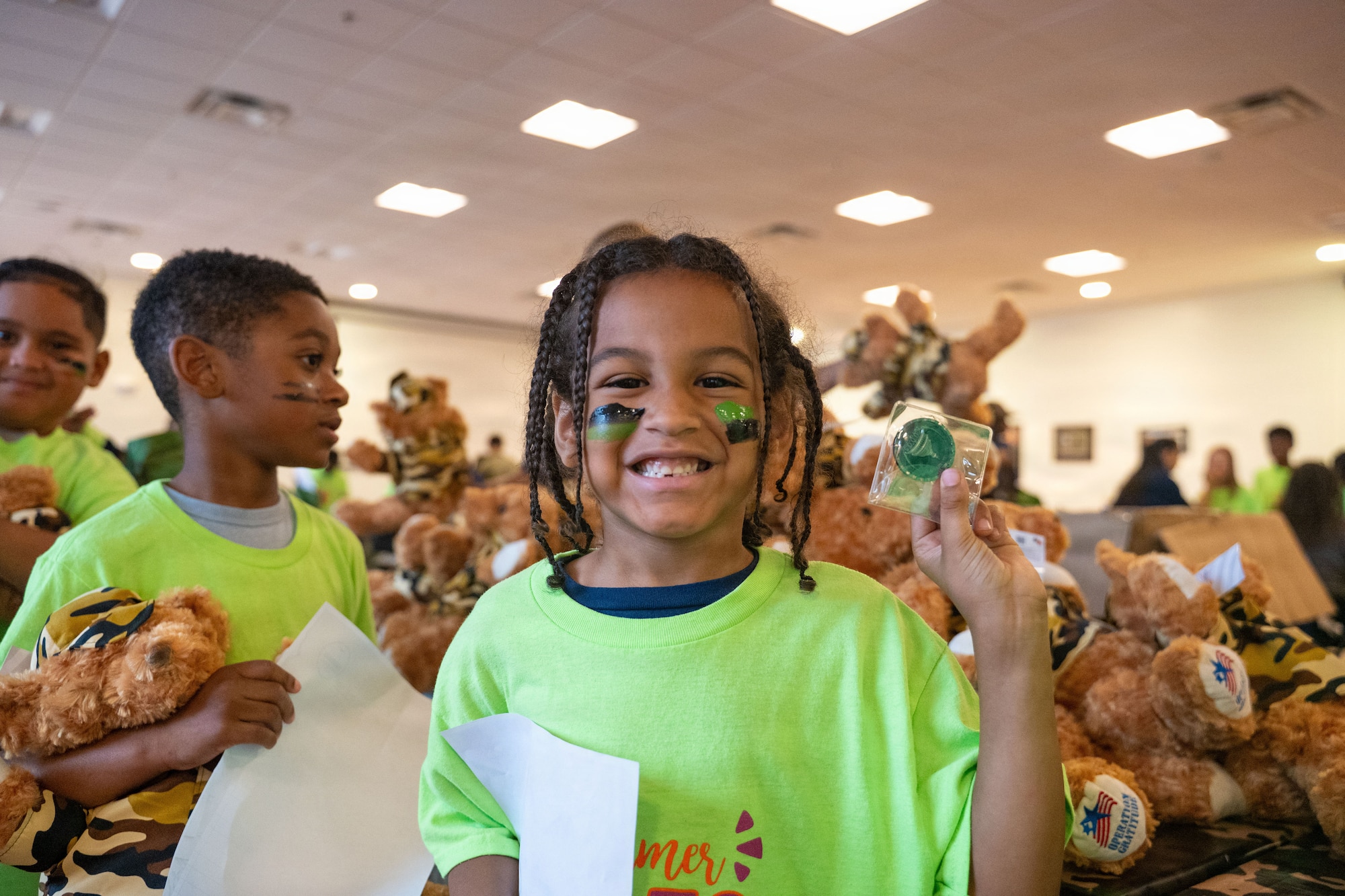 A boy showcases a completion coin