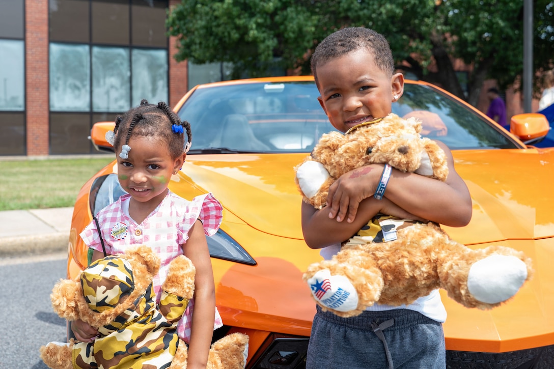 Children show off their stuffed toys