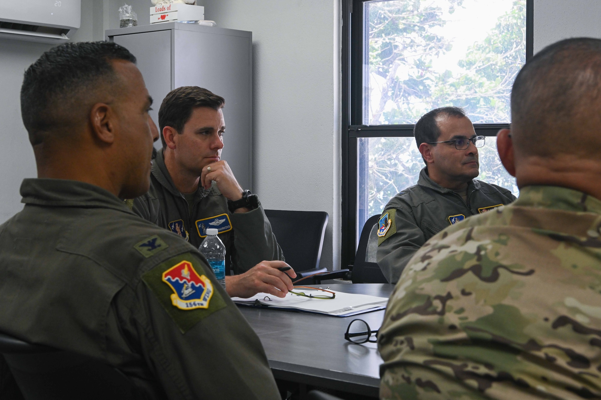 U.S. Air Force Brig. Gen. Jake Hammons, director, plans and programs for the Air National Guard, Brig. Gen Humberto Pabon Jr., commander of the Puerto Rico Air National Guard, Col. Evaristo Orengo, commander of the 156th Wing and PRANG leadership, meet during a site visit at Punta Salinas Air National Guard Station, Puerto Rico, June 6, 2026. Hammons visited the PRANG to observe its combat communications, contingency response, and air control missions firsthand, as they relate to operational readiness and resourcing decisions. (U.S. Air National Guard photo by Senior Airman Victoria A. Jewett)