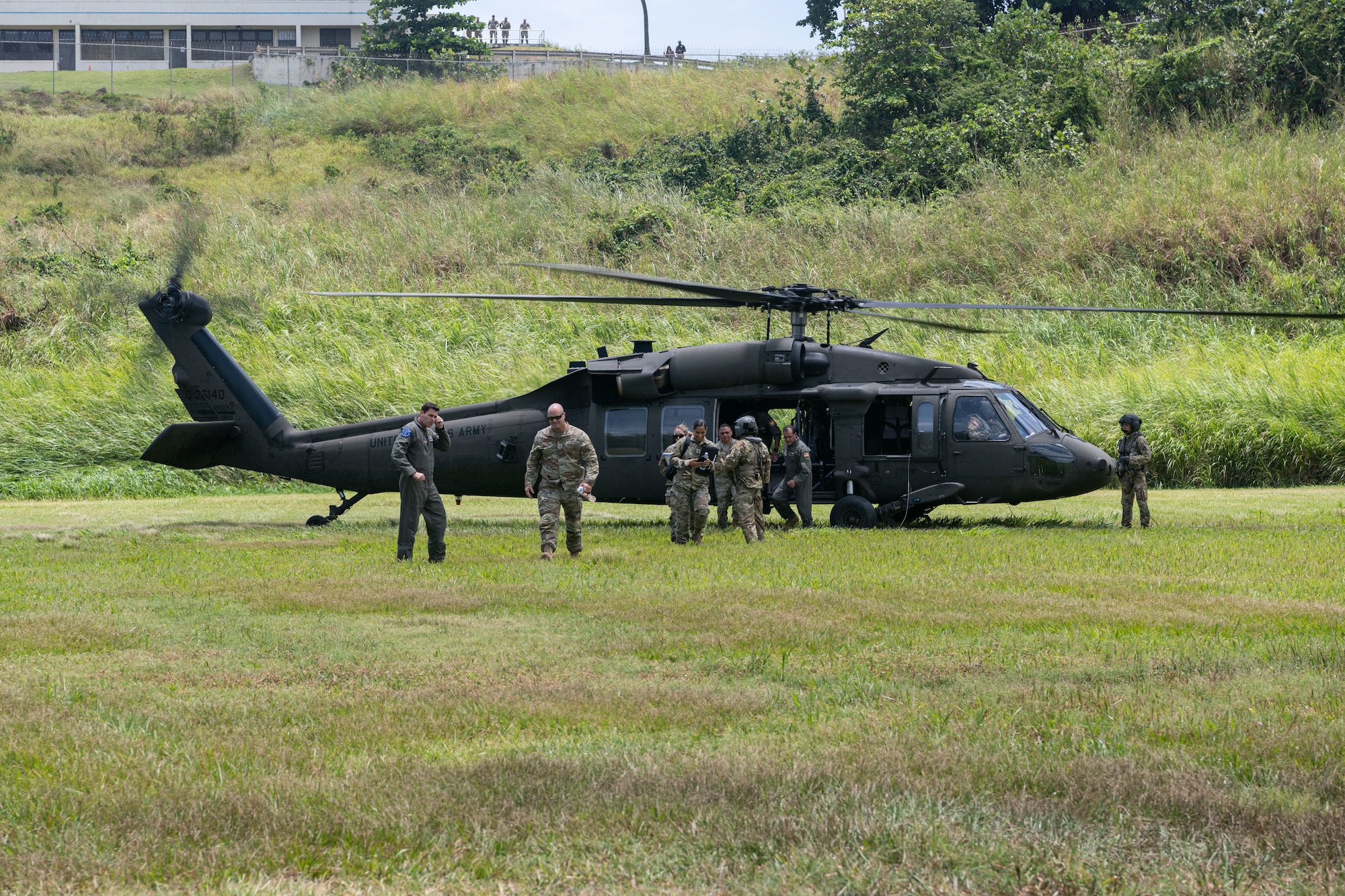 U.S. Air Force Brig. Gen. Jake Hammons, director, plans and programs for the Air National Guard, and Puerto Rico Air National Guard leadership, debark from a UH-60 Black Hawk helicopter during a site visit at Punta Salinas Air National Guard Station, Puerto Rico, June 6, 2026. Hammons visited the PRANG to observe its combat communications, contingency response, and air control missions firsthand, as they relate to operational readiness and resourcing decisions. (U.S. Air National Guard photo by Lt. Col. Matt Murphy)