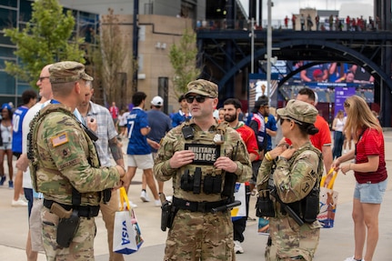 Soldiers from the 972nd Military Police Company and 211th Military Police Battalion, Massachusetts National Guard, provide security at an entrance area at Boston Stadium before a FIFA World Cup game, June 26, 2026.