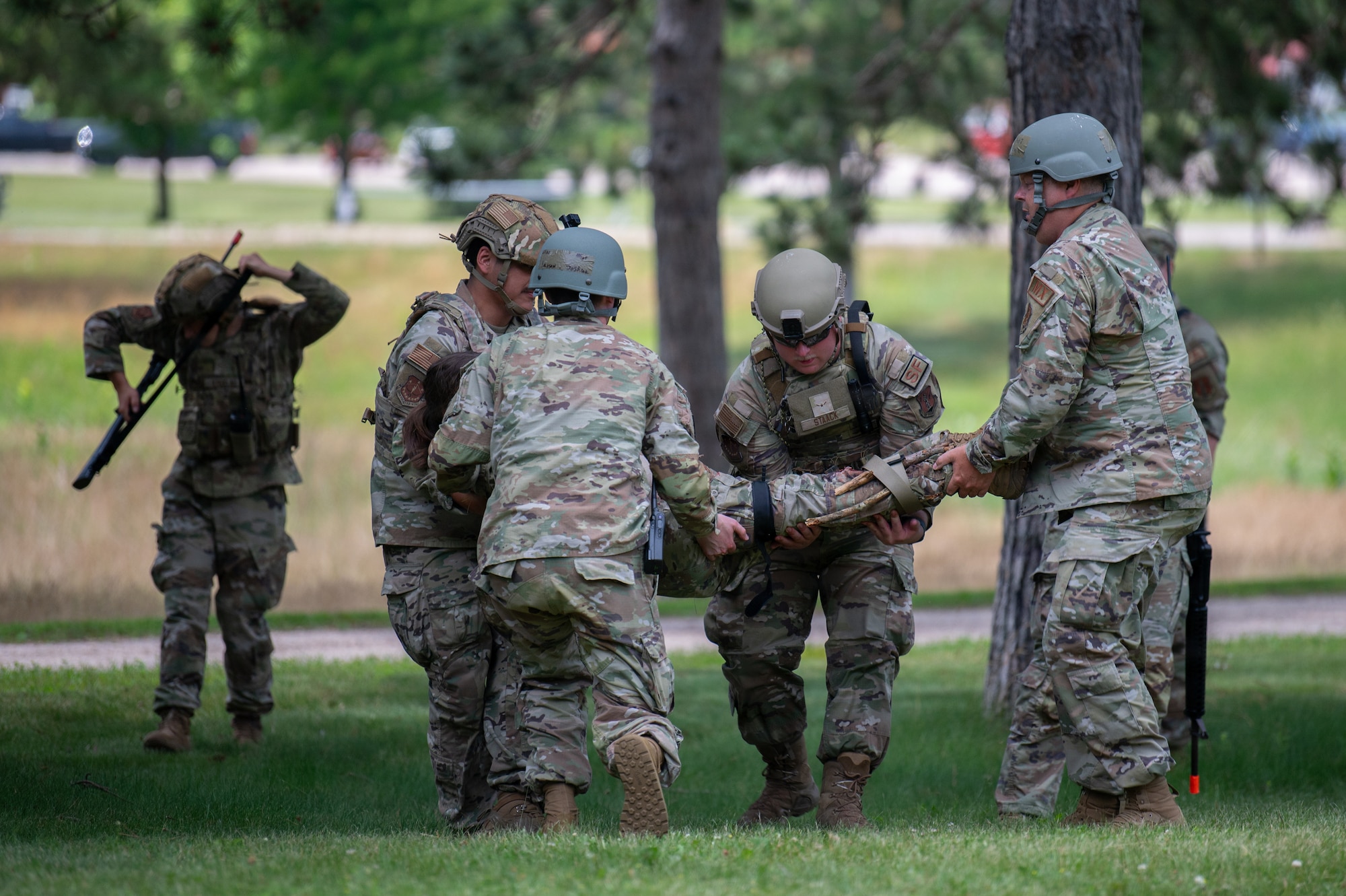 U.S. Airmen assigned to the 115th Fighter Wing, Wisconsin Air National Guard, practice life saving procedures during a combat readiness exercise, Operation Iron Orchid, at Volk Field Air National Guard Base, Camp Douglas, Wisconsin, June 23, 2026. Operation Iron Orchid is designed to assess and reinforce the wing’s ability to generate combat capability, sustain operations, protect personnel and resources, respond to evolving conditions, and execute mission-essential tasks in a realistic and challenging environment. (U.S. Air National Guard photo by Airman Alec Martin)