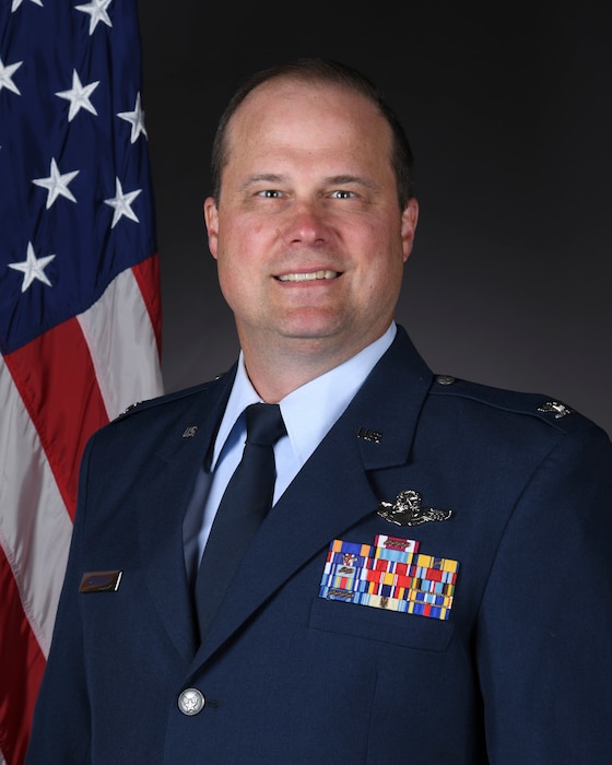 Service member poses for photo