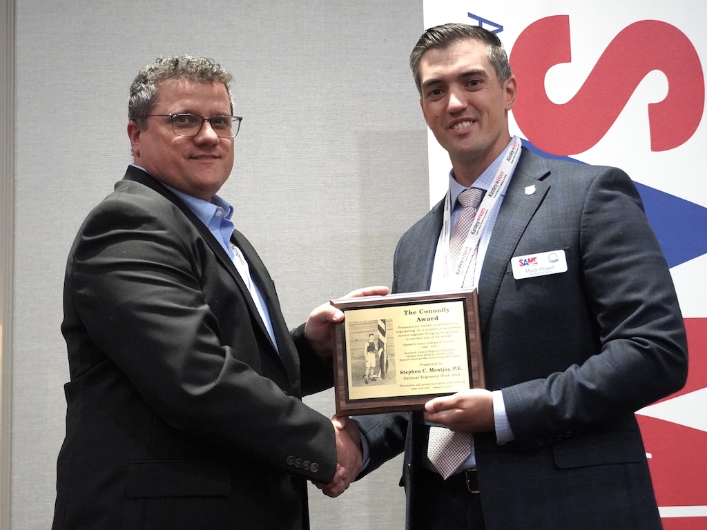Photo of Stephen Montjoy being presented an award by SAME Savannah Post President, Mack Howell.