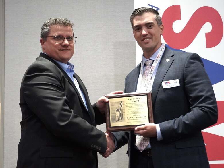 Photo of Stephen Montjoy being presented an award by SAME Savannah Post President, Mack Howell.