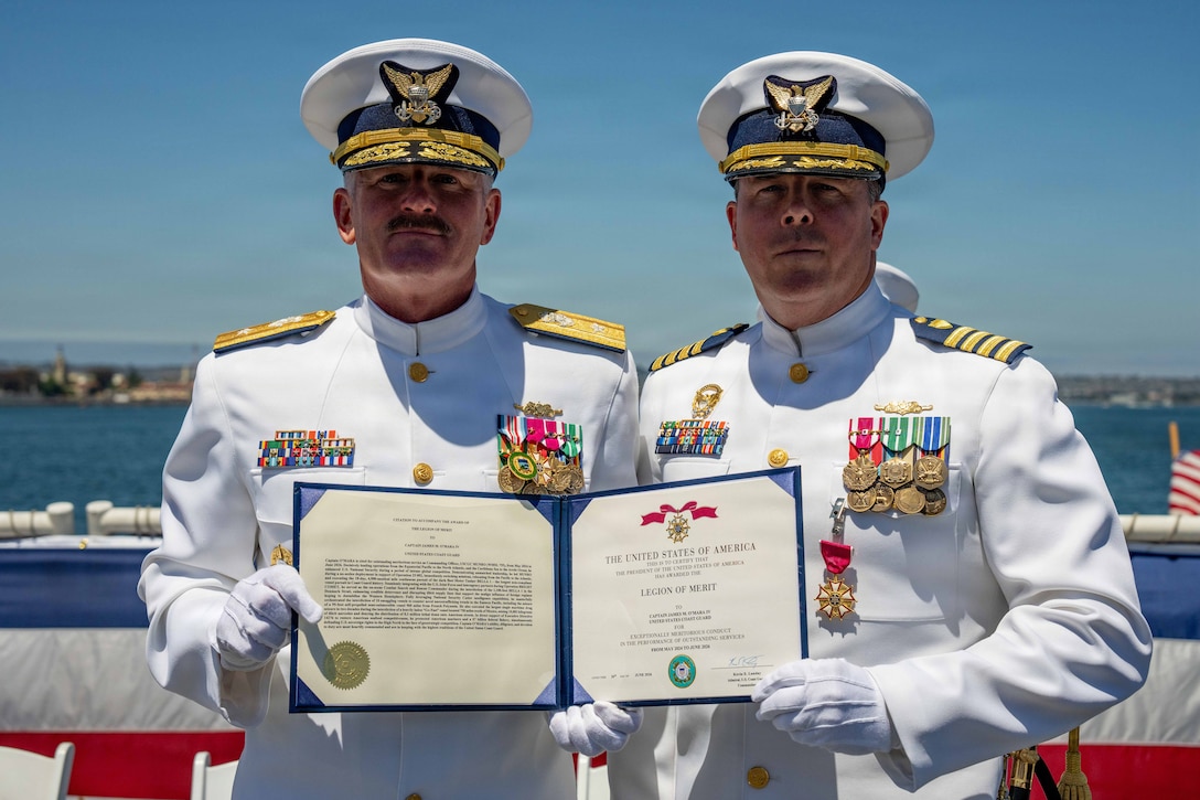 U.S. Coast Guard Rear Admiral Jeffery W. Novak (left) presents Captain James O’Mara the Legion of Merit in San Diego, June 26, 2026. The Legion of Merit is a military award given for exceptionally meritorious conduct in the performance of outstanding services and achievements. (U.S. Coast Guard photo by Petty Officer 3rd Class Chris Sappey)