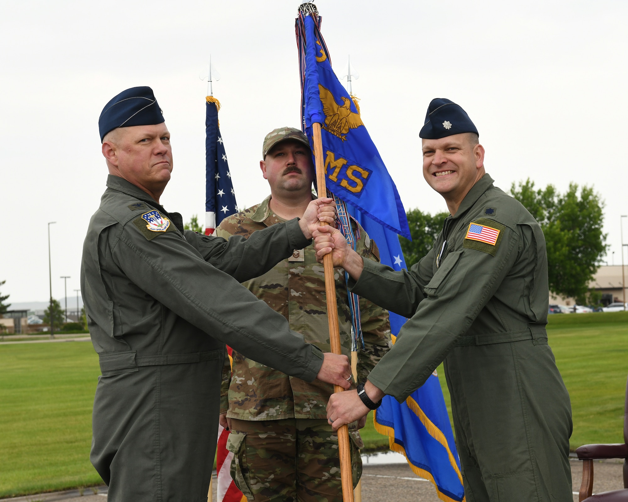 U.S. Air Force Lt. Col. Jacob Waddy, right, accepts command of the 10th Missile Squadron at Malmstrom Air Force Base, Montana, June 30, 2026.