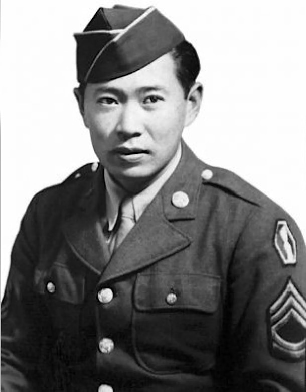 A man is wearing a military dress uniform.