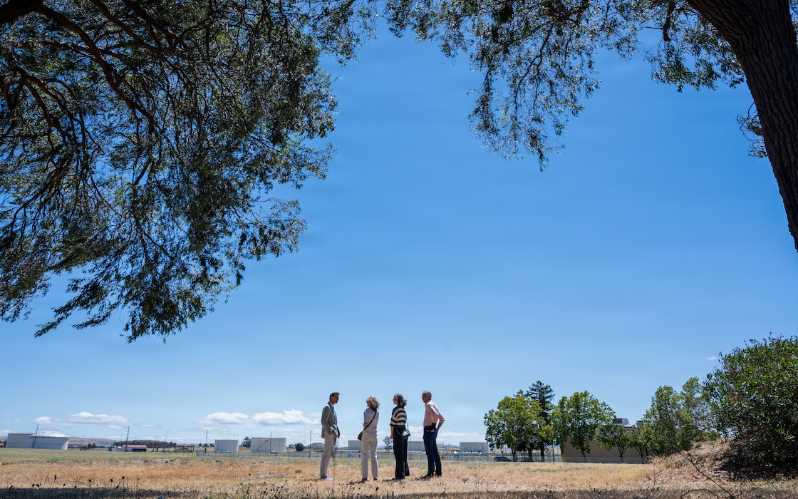 Group stands in field