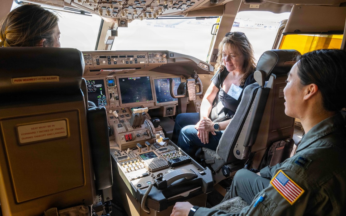 Honorary commanders sit in the cockpit.