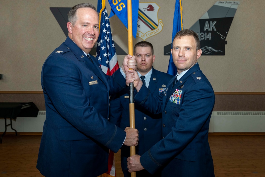 U.S. Air Force Lt. Col. Nathan Schultz, right, assumes command of the 354th Force Support Squadron from U.S. Air Force Col. Timothy Foster, 354th Mission Support Group commander, during a change of command ceremony at Eielson Air Force Base, Alaska, June 26, 2026.