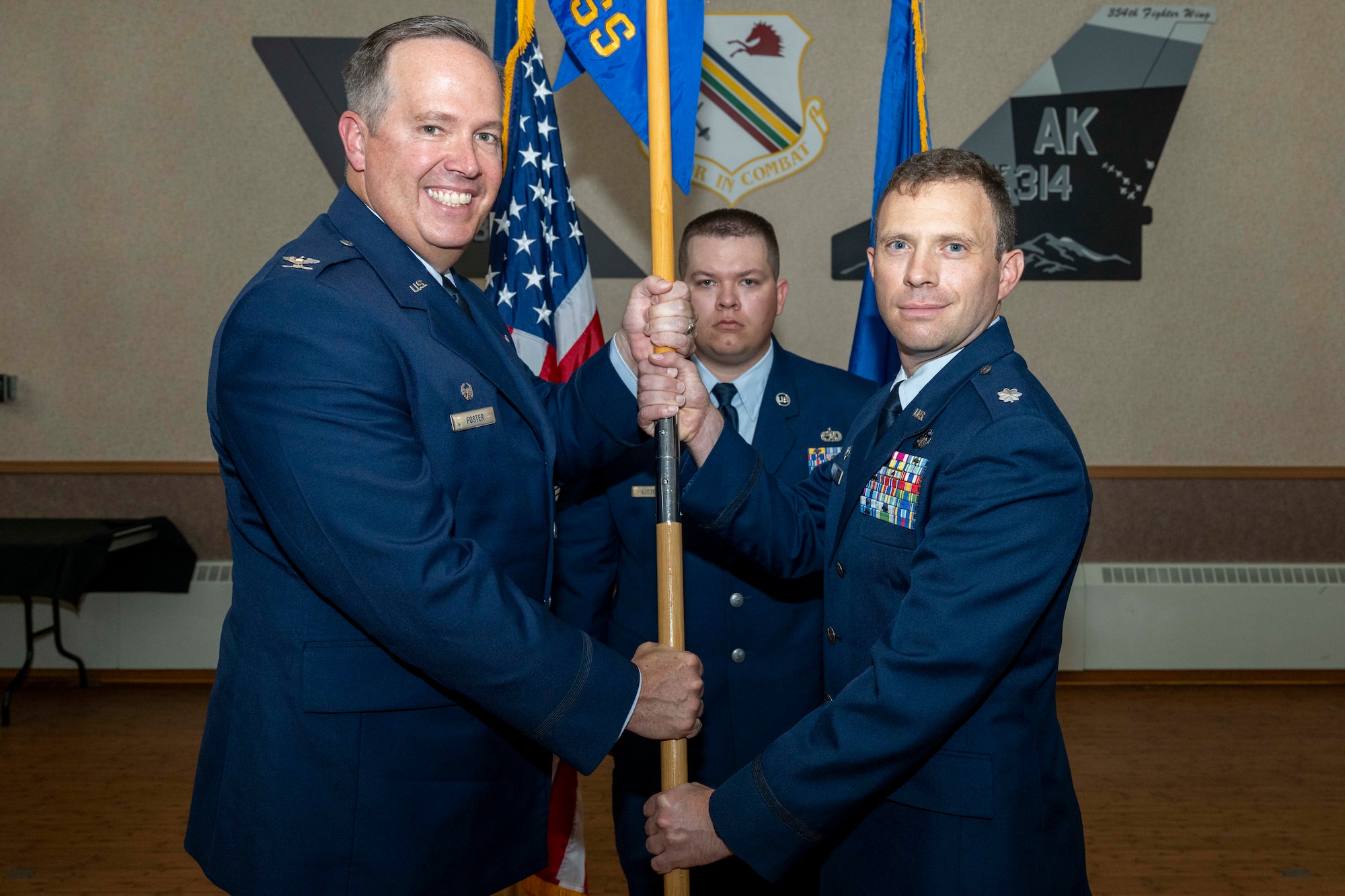 U.S. Air Force Lt. Col. Nathan Schultz, right, assumes command of the 354th Force Support Squadron from U.S. Air Force Col. Timothy Foster, 354th Mission Support Group commander, during a change of command ceremony at Eielson Air Force Base, Alaska, June 26, 2026.