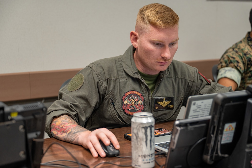 U.S. Marine Corps Staff Sgt. Joshua Prather, a student with Marine Aviation Logistics Squadron 14 assigned to the Air Force Combat Ammunition Center Class 26-006, works on a laptop at Beale Air Force Base, California, June 11, 2026.